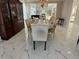 Elegant dining room featuring a chandelier, large china cabinet and dining table with seating for eight at 3011 Flat Shoals Sw Rd, Conyers, GA 30094