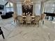 Bright dining room with large windows, chandelier, dining table with 6 chairs, and decorative furnishings at 3011 Flat Shoals Sw Rd, Conyers, GA 30094
