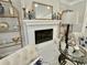 Cozy fireplace with elegant decor, including a gold-framed mirror and decorative vases and candles at 3011 Flat Shoals Sw Rd, Conyers, GA 30094