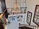 A crystal chandelier hangs over the foyer with marble floors and decorative wrought iron accents at 3011 Flat Shoals Sw Rd, Conyers, GA 30094