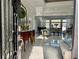 Grand foyer with marble floors, an ornate mirror, and a view into the spacious living area at 3011 Flat Shoals Sw Rd, Conyers, GA 30094