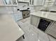 Bright kitchen with stainless steel appliances, quartz countertops, and a center island with a wine cooler at 3011 Flat Shoals Sw Rd, Conyers, GA 30094
