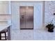 Kitchen with a stainless steel refrigerator built into custom cabinetry, plus stone accent wall at 3011 Flat Shoals Sw Rd, Conyers, GA 30094