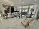 Bright living room with marble floors, stylish seating, and large windows with natural light at 3011 Flat Shoals Sw Rd, Conyers, GA 30094