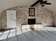 Living area highlighting a stone fireplace, ceiling fan, and access to the outdoors at 3011 Flat Shoals Sw Rd, Conyers, GA 30094