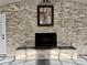 Stone accent wall with a fireplace adding character and style to the large living space at 3011 Flat Shoals Sw Rd, Conyers, GA 30094