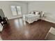 Spacious main bedroom with hardwood floors, natural light, and neutral color palette at 3011 Flat Shoals Sw Rd, Conyers, GA 30094