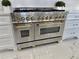 Close-up of a ZLINE stainless steel gas range with gold accents, perfect for gourmet cooking at 3011 Flat Shoals Sw Rd, Conyers, GA 30094