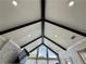 Dramatic vaulted ceiling with dark wood beams and recessed lighting over the living room at 3011 Flat Shoals Sw Rd, Conyers, GA 30094