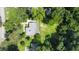 Overhead view of the home with a well-manicured lawn and mature trees in a quiet residential setting at 6538 N Sweetwater Rd, Lithia Springs, GA 30122