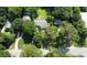Aerial perspective of a neighborhood highlighting the property, surrounding greenery, and street layout at 6538 N Sweetwater Rd, Lithia Springs, GA 30122