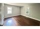 Comfortable bedroom showcasing natural light from its windows and hardwood floors for a relaxing atmosphere at 6538 N Sweetwater Rd, Lithia Springs, GA 30122