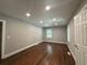 Bright bedroom with hardwood floors, neutral walls, recessed lighting, and two windows, offering ample space at 6538 N Sweetwater Rd, Lithia Springs, GA 30122
