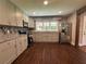 Modern kitchen with granite counters, stainless steel appliances, and gray cabinets at 6538 N Sweetwater Rd, Lithia Springs, GA 30122