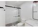 Bathroom featuring white tiled shower with sliding glass doors, granite topped vanity and modern fixtures at 1601 Augusta Se Dr, Marietta, GA 30067