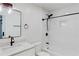 Bright, updated bathroom featuring a tub with shower and tiled surround at 1601 Augusta Se Dr, Marietta, GA 30067