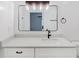 Bathroom vanity with a large mirror, stylish lighting, and granite countertop at 1601 Augusta Se Dr, Marietta, GA 30067