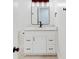 Bathroom vanity boasts shaker cabinets, drawers, granite countertop and modern fixtures at 1601 Augusta Se Dr, Marietta, GA 30067