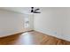 Bedroom featuring wood flooring, a ceiling fan and a window for natural light at 1601 Augusta Se Dr, Marietta, GA 30067