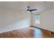 Cozy bedroom with ceiling fan, window and wood-look flooring at 1601 Augusta Se Dr, Marietta, GA 30067