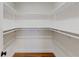 Walk-in closet features white walls, shelving, and wood floor at 1601 Augusta Se Dr, Marietta, GA 30067