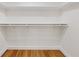 Walk-in closet with white shelving and rod for organized storage at 1601 Augusta Se Dr, Marietta, GA 30067