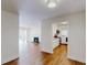 Open-concept living space featuring hardwood floors, a fireplace, and a view to the modern kitchen at 1601 Augusta Se Dr, Marietta, GA 30067