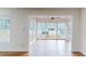 Bright sun room with hardwood floors and large windows offering ample natural light and views of the outdoors at 1601 Augusta Se Dr, Marietta, GA 30067