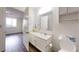 Well-lit bathroom featuring a vanity with sink and a view into bedroom at 300 Johnson Ferry Ne Rd # B604, Atlanta, GA 30328