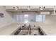 Double basin stainless steel kitchen sink with neutral colored countertop at 300 Johnson Ferry Ne Rd # B604, Atlanta, GA 30328