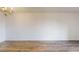 Bright living room with wood flooring and chandelier at 300 Johnson Ferry Ne Rd # B604, Atlanta, GA 30328