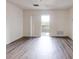 Bright living space with wood flooring and a sliding glass door to the balcony at 300 Johnson Ferry Ne Rd # B604, Atlanta, GA 30328