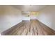 Large living space featuring wood flooring, kitchen access, and chandelier at 300 Johnson Ferry Ne Rd # B604, Atlanta, GA 30328