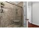 Contemporary bathroom showcasing a spacious, marble-tiled shower with a glass enclosure at 325 E Paces Ferry Ne Rd # 703, Atlanta, GA 30305