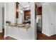 Kitchen bar with granite countertop and dark cabinets offers stainless steel appliances and great space at 325 E Paces Ferry Ne Rd # 703, Atlanta, GA 30305