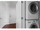 Convenient laundry area featuring stacked washer and dryer units at 325 E Paces Ferry Ne Rd # 703, Atlanta, GA 30305