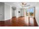 Open-concept living room featuring hardwood floors, neutral walls, and access to a balcony at 325 E Paces Ferry Ne Rd # 703, Atlanta, GA 30305