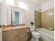 Bathroom features a vanity, toilet, tub/shower combo, and vintage tiled flooring at 4150 Glenn St, Powder Springs, GA 30127