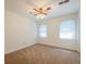 Cozy bedroom featuring a ceiling fan and two sunny windows at 4150 Glenn St, Powder Springs, GA 30127