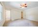Sunlit bedroom with carpet, closet, and access to an attached bathroom at 4150 Glenn St, Powder Springs, GA 30127