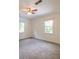 Bright bedroom with two windows offering views of the surrounding greenery at 4150 Glenn St, Powder Springs, GA 30127