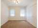 Bedroom featuring a large closet, carpet flooring, and natural light at 4150 Glenn St, Powder Springs, GA 30127