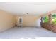Attached covered carport with brick supports and an entry door at 4150 Glenn St, Powder Springs, GA 30127
