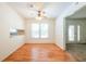 Dining room featuring hardwood floors, a window, and easy access to living room at 4150 Glenn St, Powder Springs, GA 30127