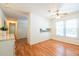 A bright dining room has a window and wood floors, creating a perfect dining experience at 4150 Glenn St, Powder Springs, GA 30127