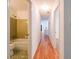 Hallway connecting a retro bathroom and carpeted bedroom at 4150 Glenn St, Powder Springs, GA 30127