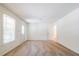 Bright living room featuring neutral carpet, one window, and a front door with decorative glass at 4150 Glenn St, Powder Springs, GA 30127