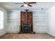 Bright living room featuring neutral carpet, a brick fireplace, and built-in shelving at 4150 Glenn St, Powder Springs, GA 30127