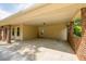 Spacious covered patio features brick columns, concrete floor, and provides an outdoor living space at 4150 Glenn St, Powder Springs, GA 30127