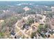 Wide aerial shot of the neighborhood, revealing the tranquil, treelined streets and community layout at 8870 Dornoch Cir, Winston, GA 30187